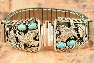 Genuine Sleeping Beauty Turquoise set in Sterling Silver. Beautiful Sterling Silver Eagle Design. Mens Watch Tips with expandable band. Created by Navajo Artist Thomas Chischilly.