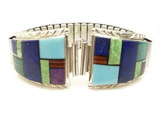 Genuine Turquoise, Blue Lapis, Malachite and Spiny Oyster Shell inlaid in Sterling Silver Watch Tip. Watch Tip includes expandable band. Created by Navajo Artist Wallace Long.