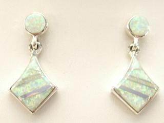 Stunning Fire & Ice Lab Opals inlaid between ribbons of Sterling Silver. Beautiful Sterling Silver Post Earrings feature precision channel inlay. Created by Navajo Artist Calvin Begay. 

