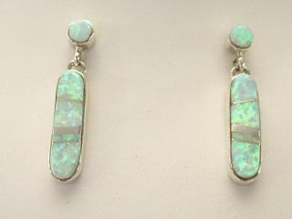 Fire & Ice Lab Opals inlaid between ribbons of Sterling Silver. Beautiful Sterling Silver Post Earrings feature precision channel inlay. Designed by Navajo Artist Calvin Begay. Signed.

