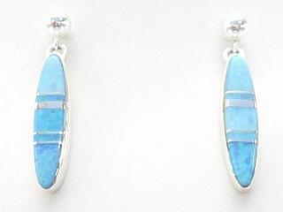 Beautiful Fire & Ice Lab Opals inlaid between ribbons of Sterling Silver. Sterling Silver Post Earrings feature precision channel inlay. Designed by Navajo Artist Calvin Begay. Signed.
