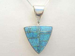 Authentic Native American Jewelry. Fire & Ice Lab Opals inlaid between ribbons of Sterling Silver. Beautiful precision channel inlay. Reversible pendant features a beautiful raised Sterling Silver Design. Free 18