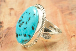 Genuine Sleeping Beauty Turquoise set in Sterling Silver. The Sleeping Beauty Turquoise mine is located in Gila County, Arizona. Created by Navajo Artist Phillip Sanchez. Signed by the artist.
