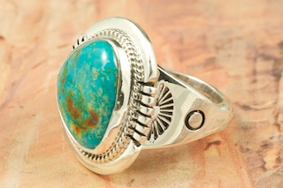 Genuine Royston Turquoise set in Sterling Silver Ring. Beautiful Matrix in this Turquoise Stone. The Royston Turquoise Mine is located in Nye County, Nevada. Created by Navajo Artist John Nelson. Signed.