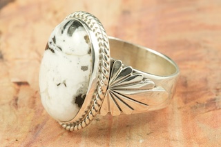White Buffalo Turquoise set in Sterling Silver Ring. This Beautiful Stone is formed from the minerals Calcite and Iron. It is mined near Tonopah Nevada. Created by Navajo Artist Thomas Chischilly. Signed by the artist.