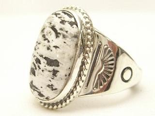 White Buffalo Turquoise set in Sterling Silver Ring. This Beautiful Stone is formed from the minerals Calcite and Iron. It is mined near Tonopah Nevada. Created by Navajo Artist Phillip Sanchez. Signed. 
