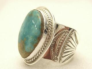 Genuine Crow Springs Turquoise set in Sterling Silver Ring. The Crow Springs Mine is located near Tonopah, Nevada. Created by Navajo Artist Phillip Sanchez. Signed.