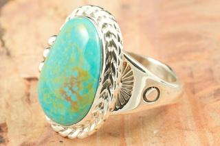 Genuine Manassa Turquoise set in Sterling Silver Ring. This Turquoise is also referred to as King�s Manassa Turquoise. The Manassa Turquoise mine is located in Manassa, Conejos County, Colorado. Created by Navajo Artist Tony Garcia. Signed by the artist.
