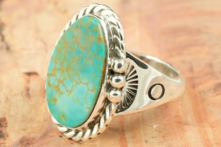 Genuine Manassa Turquoise set in Sterling Silver Ring. This Turquoise is also referred to as King�s Manassa Turquoise. The Manassa Turquoise mine is located in Manassa, Conejos County, Colorado. Created by Navajo Artist Tony Garcia. Signed by the artist.