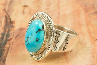 Genuine Sleeping Beauty Turquoise set in Sterling Silver. Created by Navajo Artist Kathy Yazzie. Signed by the artist. The Sleeping Beauty Turquoise mine is located in Gila County, Arizona.
