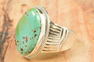 Genuine Royston Turquoise Stone set in Sterling Silver Ring. The Royston Turquoise Mine is located in Nye County, Nevada. Created by Navajo Artist John Nelson. Signed by the artist.