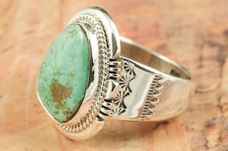 Genuine Crow Springs Turquoise set in Sterling Silver Ring. The Crow Springs Mine is located near Tonopah, Nevada. Created by Navajo Artist John Nelson. Signed by the artist.