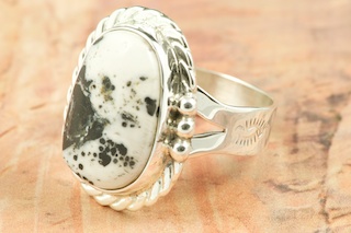 White Buffalo Turquoise set in Sterling Silver Ring. This Beautiful Stone is formed from the minerals Calcite and Iron. It is mined near Tonopah Nevada. Created by Navajo Artist Tony Garcia. Signed by the artist.