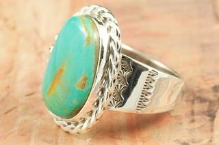 Genuine Manassa Turquoise set in Sterling Silver Ring. This Turquoise is also referred to as King�s Manassa Turquoise. The Manassa Turquoise mine is located in Manassa, Conejos County, Colorado. Created by Navajo Artist Tony Garcia. Signed by the artist.