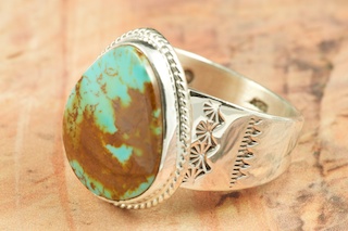Genuine Manassa Turquoise set in Sterling Silver Ring. This Turquoise is also referred to as King�s Manassa Turquoise. The Manassa Turquoise mine is located in Manassa, Conejos County, Colorado. Created by Navajo Artist Phillip Sanchez. Signed by the artist.