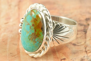 Genuine Manassa Turquoise set in Sterling Silver Ring. This Turquoise is also referred to as King�s Manassa Turquoise. The Manassa Turquoise mine is located in Manassa, Conejos County, Colorado. Created by Navajo Artist Tony Garcia. Signed by the artist.