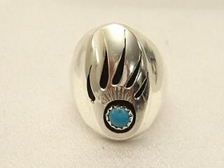 Authentic Native American Jewelry. Genuine Turquoise set in Sterling Silver Ring. Beautiful Bear Paw Design. Created by Navajo Artist Rose Silago. 
