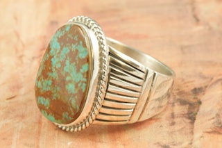 Genuine Manassa Turquoise set in Sterling Silver Ring. This Turquoise is also referred to as King�s Manassa Turquoise. The Manassa Turquoise mine is located in Manassa, Conejos County, Colorado. Created by Navajo Artist Tony Garcia. Signed by the artist.