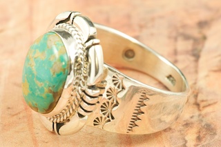 Genuine Crow Springs Turquoise set in Sterling Silver Ring. The Crow Springs Mine is located near Tonopah, Nevada. Created by Navajo Artist Freddy Charlie. Signed by the artist.
