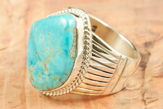 Genuine Hachita Turquoise set in Sterling Silver Ring. Created by Navajo Artist Phillip Sanchez. Signed by the artist. The Hachita Turquoise Mine is located in southern New Mexico. It was mined from pre-historic times to 1905. The name 