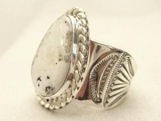White Buffalo Turquoise set in Sterling Silver Ring. This Beautiful Stone is formed from the minerals Calcite and Iron. It is mined near Tonopah Nevada. Created by Navajo Artist Phillip Sanchez. Signed. 
