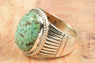 Genuine High Grade Kingman Turquoise set in Sterling Silver Ring. Beautiful Spider Web Matrix. The Kingman Turquoise Mine is located in Mohave County, Arizona. Created by Navajo Artist Thomas Chischilly. Signed by the artist.