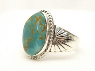 White Buffalo Turquoise set in Sterling Silver Ring. This Beautiful Stone is formed from the minerals Calcite and Iron. It is mined near Tonopah Nevada. Created by Navajo Artist Phillip Sanchez. Signed. 
