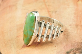 Genuine Crow Springs Turquoise set in Sterling Silver Ring. The Crow Springs Mine is located near Tonopah, Nevada. Created by Navajo Artist Thomas Valencia. Signed. 

