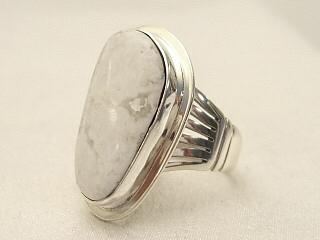White Buffalo Turquoise set in Sterling Silver Ring. This Beautiful Stone is formed from the minerals Calcite and Iron. It is mined near Tonopah Nevada. Created by Navajo Artist Phillip Sanchez. Signed. 

