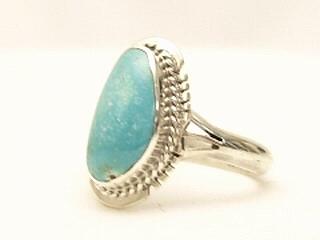 Genuine Sunnyside Turquoise set in Sterling Silver Ring. The matrix on this rare stone is outstanding. The Sunnyside mine is located in northern Nevada near the town of Tuscarora in the Tuscarora mountain range. The mine is no longer in operation as it has become part of a gold mining operation and a privately owned ranch. The Sunnyside mine was mined mostly in the 70's. You won't find much of this great turquoise around anymore except for old stashes. Created by Navajo Artist Arkie Nelson. Signed.