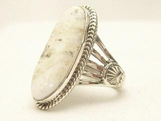 White Buffalo Turquoise set in Sterling Silver Ring. This Beautiful Stone is formed from the minerals Calcite and Iron. It is mined near Tonopah Nevada. Created by Navajo Artist Tony Garcia. 