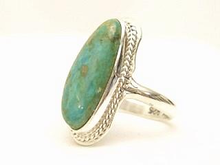 Genuine Crow Springs Turquoise set in Sterling Silver Ring. The Crow Springs Mine is located near Tonopah, Nevada. Created by Navajo Artist Freddy Charlie. Signed.