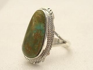 Genuine Crow Springs Turquoise set in Sterling Silver Ring. The Crow Springs Mine is located near Tonopah, Nevada. Created by Navajo Artist Larson Lee. Signed. 
