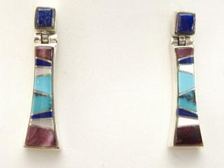 Genuine Sugilite, Blue Lapis, Mother of Pearl and Turquoise inlaid between ribbons of Sterling Silver. Beautiful Sterling Silver Post Earrings feature precision channel inlay. Designed by Navajo Artist Calvin Begay. Signed.
