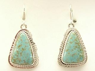 Genuine Number 8 Mine Turquoise set in Sterling Silver French Wire Earrings. The Number 8 mine is located in Eureka County Nevada. Since 1976 there has been no Number 8 Turquoise mined. There is however, an existing stock pile that Mr. Dowell Ward, the last owner of the Number 8 mine, had stocked away for later sorting. The Turquoise is a collector's item--because once the reserve is gone there will be no more material released onto the market. The Gold Mining Company owns the claim to the Number 8 mine and it has been swallowed up by the gold mining operations. This is some of the last Number 8 Turquoise to be had and will be a great addition to your collection. Created by Navajo Artist Lucy Valencia. Signed LJ.