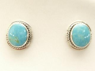 Genuine Number 8 Mine Turquoise set in Sterling Silver Post Earrings. The Number 8 mine is located in Eureka County Nevada. Since 1976 there has been no Number 8 Turquoise mined. There is however, an existing stock pile that Mr. Dowell Ward, the last owner of the Number 8 mine, had stocked away for later sorting. The Turquoise is a collector's item--because once the reserve is gone there will be no more material released onto the market. The Gold Mining Company owns the claim to the Number 8 mine and it has been swallowed up by the gold mining operations. This is some of the last Number 8 Turquoise to be had and will be a great addition to your collection. Created by Navajo Artist Arkie Nelson.
