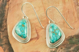 Genuine Crow Springs Turquoise set in Sterling Silver Post Earrings. The Crow Springs Mine is located near Tonopah, Nevada. Created by Navajo Artist BJ Piaso. Signed. 