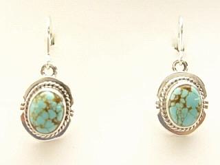 Genuine Number 8 Mine Turquoise Stones set in Sterling Silver French Wire Earrings. The Number 8 mine is located in Eureka County Nevada. Since 1976 there has been no Number 8 Turquoise mined. There is however, an existing stock pile that Mr. Dowell Ward, the last owner of the Number 8 mine, had stocked away for later sorting. The Turquoise is a collector's item--because once the reserve is gone there will be no more material released onto the market. The Gold Mining Company owns the claim to the Number 8 mine and it has been swallowed up by the gold mining operations. This is some of the last Number 8 Turquoise to be had and will be a great addition to your collection. Created by Navajo Artist Jake Sampson. 
