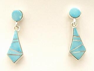 Genuine Sleeping Beauty Turquoise inlaid between ribbons of Sterling Silver. Beautiful Sterling Silver Post Earrings feature precision channel inlay. Designed by Navajo Artist Calvin Begay. Signed.
