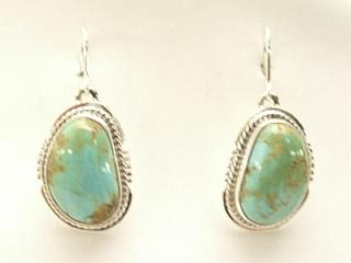 Genuine Crow Springs Turquoise set in Sterling Silver French Wire Earrings. The Crow Springs Mine is located near Tonopah, Nevada. Created by Navajo Artist Larson Lee. Signed.