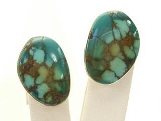 Genuine Emerald Valley Turquoise set in Sterling Silver Clip on Earrings. The Emerald Valley Mine is located in Nevada. Created by Navajo Artist Phillip Sanchez. Signed.