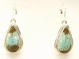 Genuine Number 8 Mine Turquoise Stones set in Sterling Silver French Wire Earrings. The Number 8 mine is located in Eureka County Nevada. Since 1976 there has been no Number 8 Turquoise mined. There is however, an existing stock pile that Mr. Dowell Ward, the last owner of the Number 8 mine, had stocked away for later sorting. The Turquoise is a collector's item--because once the reserve is gone there will be no more material released onto the market. The Gold Mining Company owns the claim to the Number 8 mine and it has been swallowed up by the gold mining operations. This is some of the last Number 8 Turquoise to be had and will be a great addition to your collection. Created by Navajo Artist Kathy Yazzie. Signed.

