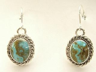 Genuine Number 8 Mine Turquoise Stones set in Sterling Silver French Wire Earrings. The Number 8 mine is located in Eureka County Nevada. Since 1976 there has been no Number 8 Turquoise mined. There is however, an existing stock pile that Mr. Dowell Ward, the last owner of the Number 8 mine, had stocked away for later sorting. The Turquoise is a collector's item--because once the reserve is gone there will be no more material released onto the market. The Gold Mining Company owns the claim to the Number 8 mine and it has been swallowed up by the gold mining operations. This is some of the last Number 8 Turquoise to be had and will be a great addition to your collection. Created by Navajo Artist Flora Willeto. Signed. 
