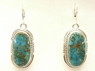 Genuine Turquoise Mountain Mine Turquoise set in Sterling Silver French Wire Earrings. The Turquoise Mountain Mine is located in the Mineral Park Mining District, Mohave County, Arizona. Although Turquoise Mountain is located near the Kingman Turquoise Mine it is considered a classic mine in its own right because the Turquoise is so different in appearance. It is also known as 