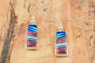 Genuine Mother of Pearl, Spiny Oyster Shell and Jet inlaid in Sterling Silver Post Earrings. Created by Navajo Artist Jimmy Poyer. Signed. Jimmy Poyer is a Navajo Indian who lives in the Four Corners. He uses all natural materials in hs jewelry designs. He hopes you enjoy this creation. 
