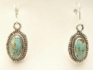 Genuine Number 8 Mine Turquoise Stones set in Sterling Silver French Wire Earrings. The Number 8 mine is located in Eureka County Nevada. Since 1976 there has been no Number 8 Turquoise mined. There is however, an existing stock pile that Mr. Dowell Ward, the last owner of the Number 8 mine, had stocked away for later sorting. The Turquoise is a collector's item--because once the reserve is gone there will be no more material released onto the market. The Gold Mining Company owns the claim to the Number 8 mine and it has been swallowed up by the gold mining operations. This is some of the last Number 8 Turquoise to be had and will be a great addition to your collection. Created by Navajo Artist Bobby Piaso. Signed.