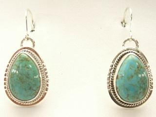Genuine Crow Springs Turquoise set in Sterling Silver French Wire Earrings. The Crow Springs Mine is located near Tonopah, Nevada. Created by Navajo Artist Tsosie White. Signed.