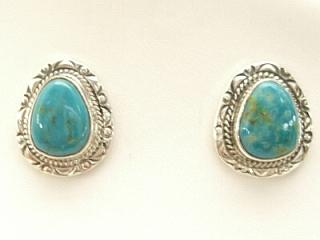 Genuine Crow Springs Turquoise set in Sterling Silver Post Earrings. The Crow Springs Mine is located near Tonopah, Nevada. Created by Navajo Artist BJ Piaso. Signed.
