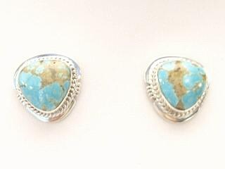Genuine Number 8 Mine Turquoise Stones set in Sterling Silver Post Earrings. The Number 8 mine is located in Eureka County Nevada. Since 1976 there has been no Number 8 Turquoise mined. There is however, an existing stock pile that Mr. Dowell Ward, the last owner of the Number 8 mine, had stocked away for later sorting. The Turquoise is a collector's item--because once the reserve is gone there will be no more material released onto the market. The Gold Mining Company owns the claim to the Number 8 mine and it has been swallowed up by the gold mining operations. This is some of the last Number 8 Turquoise to be had and will be a great addition to your collection. Created by Navajo Artist Larson Lee. Signed.