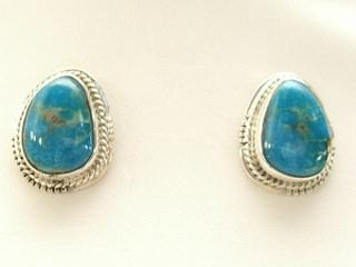 Genuine Turquoise Mountain Mine Turquoise set in Sterling Silver Post Earrings. The Turquoise Mountain Mine is located in the Mineral Park Mining District, Mohave County, Arizona. Although Turquoise Mountain is located near the Kingman Turquoise Mine it is considered a classic mine in its own right because the Turquoise is so different in appearance. It is also known as 